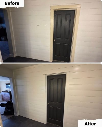 Pearl Painters in Portland repainted hallway door trim from off-white to white, giving a sharper look by the dark door.