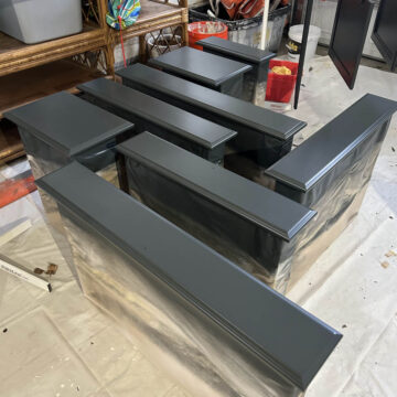 Freshly painting kitchen cabinet doors drying in garage