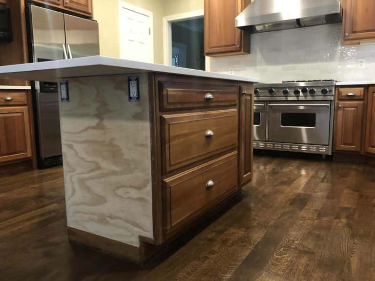 An island in a Portland kitchen with wood floors.