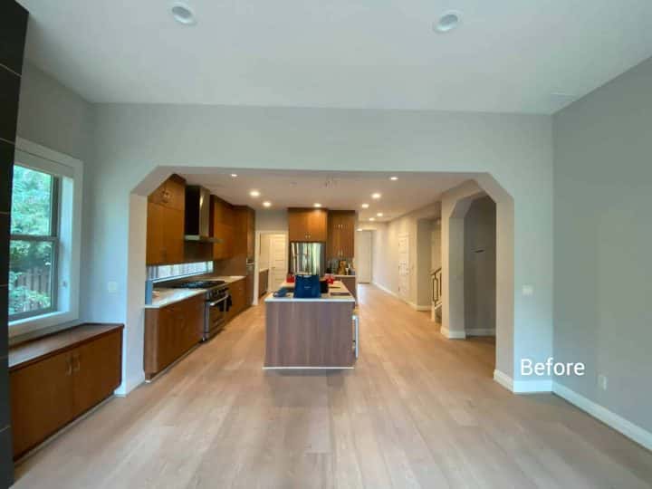 A kitchen with hardwood floors and a fireplace, designed for win and receiving 5-star Google reviews.
