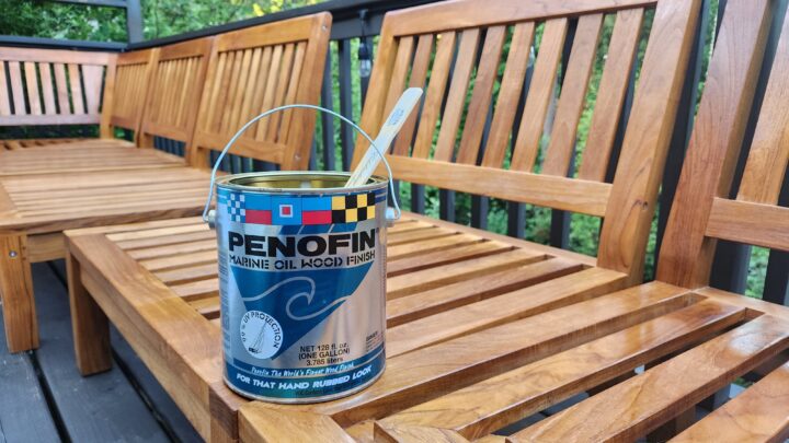 A can of paint sits on a wooden deck, ready for some summer BBQ prep.