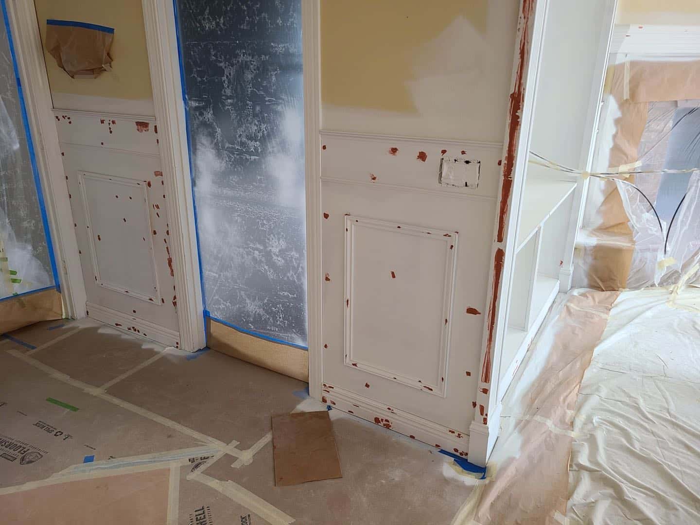 The great room in Tigard is being repainted with fresh, white paint.