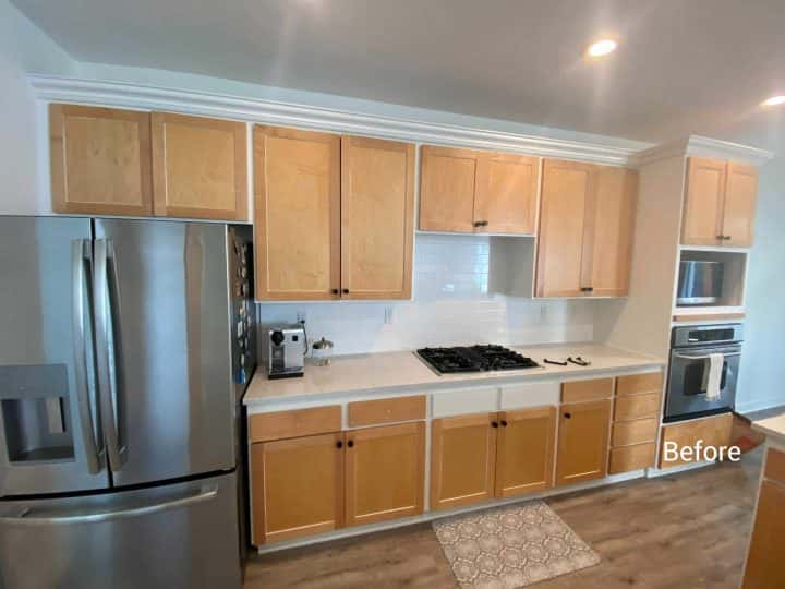 A kitchen with stainless steel appliances and Sherwood cabinets that left the client happy.