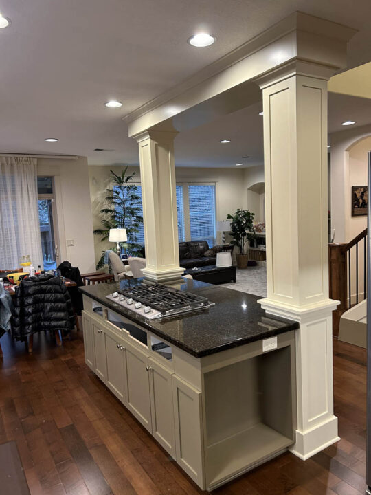 Kitchen island with large columns, all freshly repaired and painted by Pearl Painters in West Linn