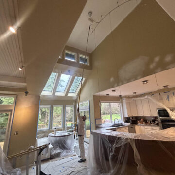 The Wilsonville Home kitchen with high ceilings is being painted.