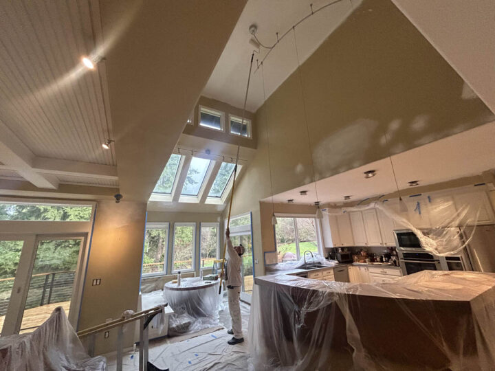 The Wilsonville Home kitchen with high ceilings is being painted.