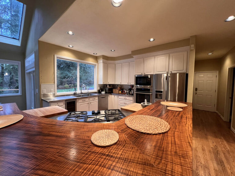 In this Wilsonville Home, you will find a kitchen with a beautiful wooden counter top.