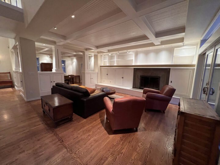 A Wilsonville home featuring a living room with a fireplace and leather chairs.